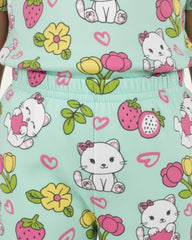 Children's outfit with cat and flower pattern on a light blue background