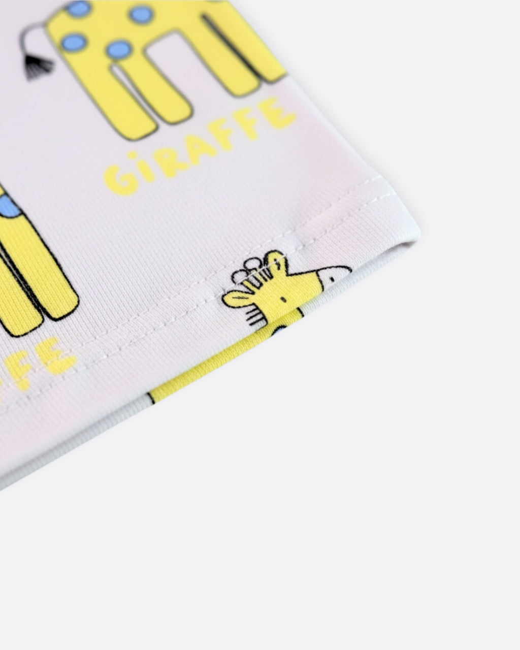 Children's pajama set with cartoon giraffe illustration on a white background