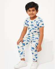 Child wearing a dinosaur-themed outfit on a white background