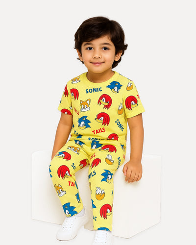 Child wearing a yellow Sonic the Hedgehog-themed outfit on a white background