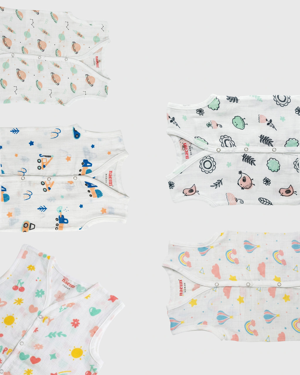 Collection of baby muslin jabla with various patterns on a white background