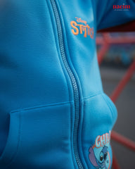 Blue hoodie with cartoon character design on a blurred background