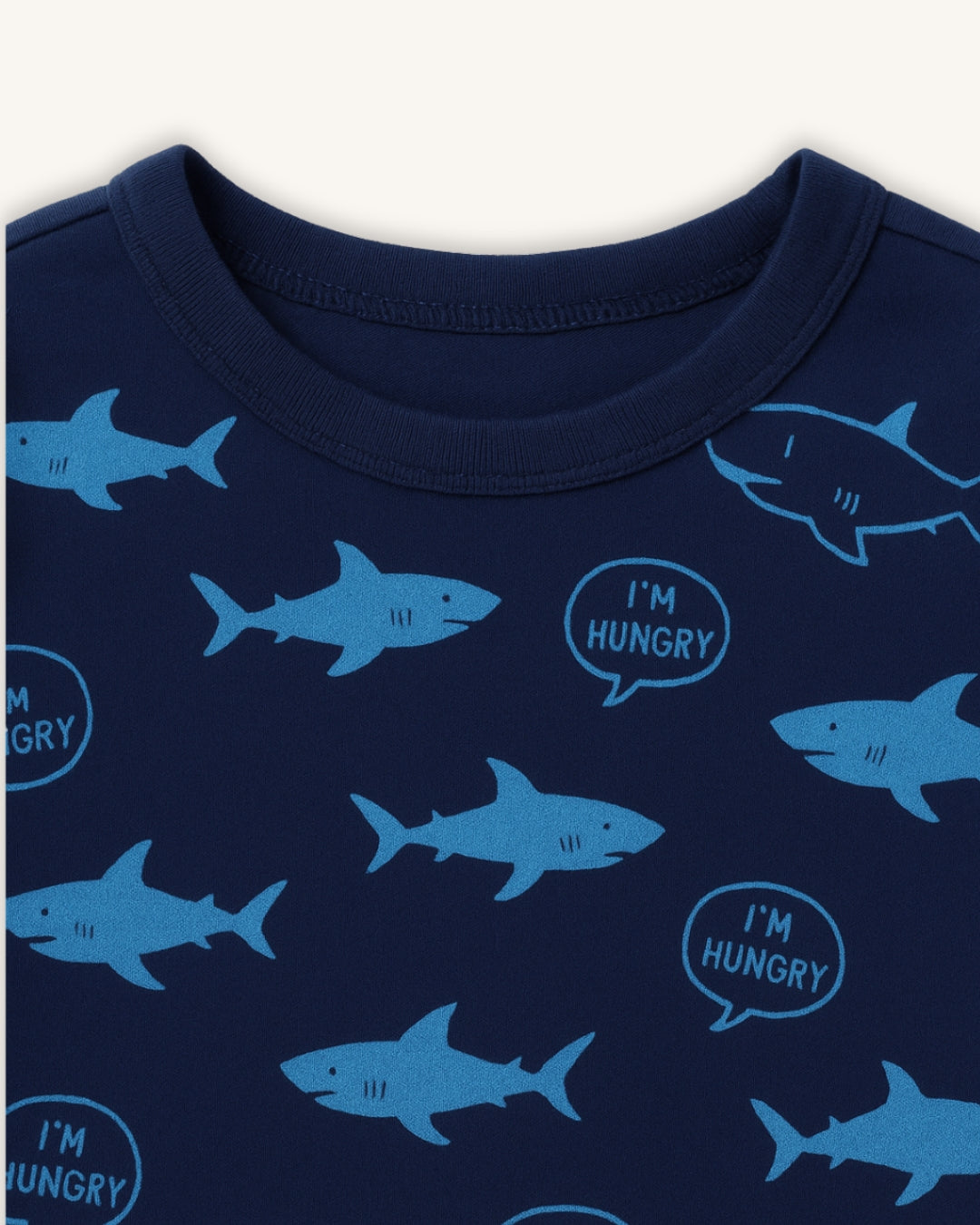 Navy blue shirt with blue shark patterns and 'I'm Hungry' text on a white background